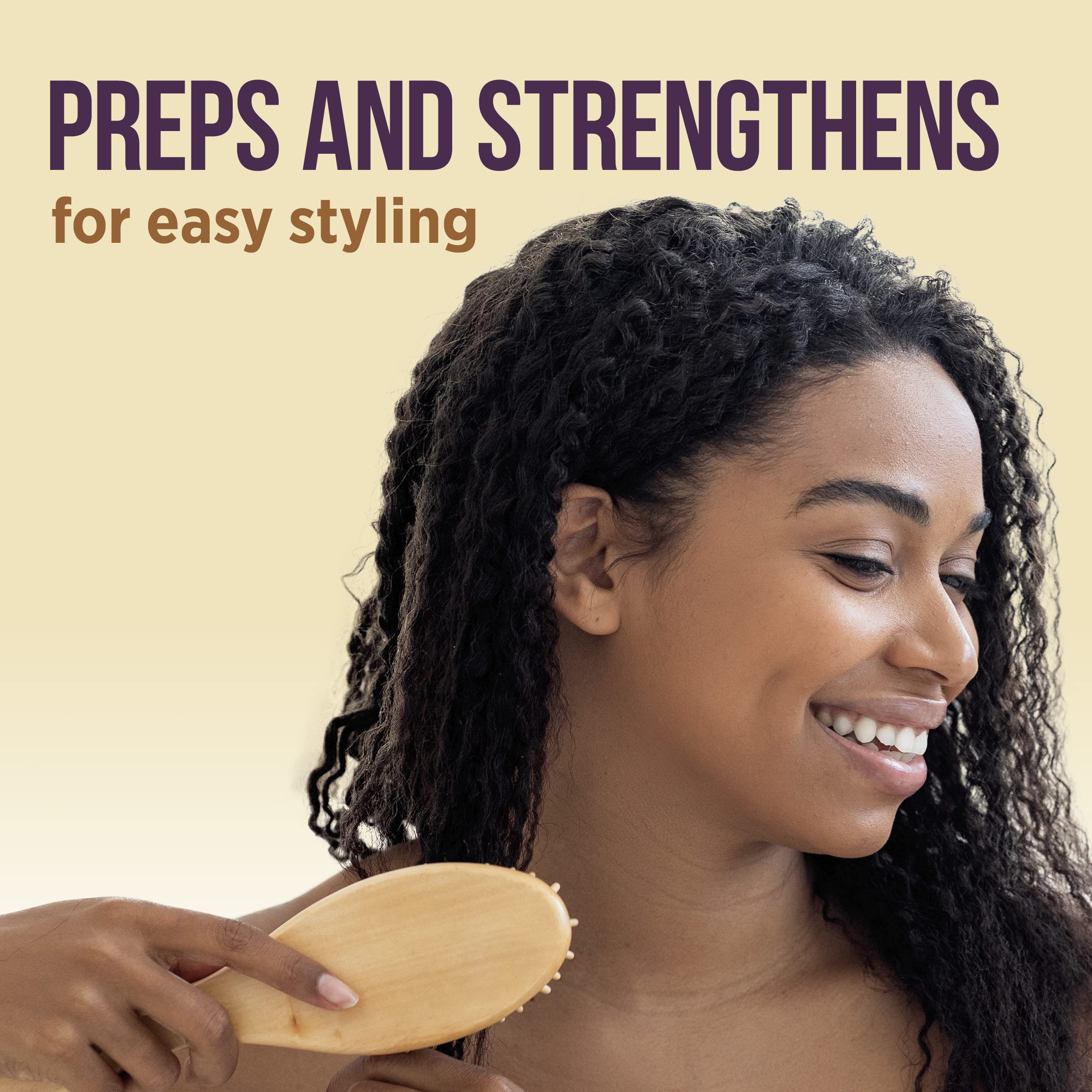 Applying Pantene Gold Series detangling milk to damp hair, reduces tugging while combing