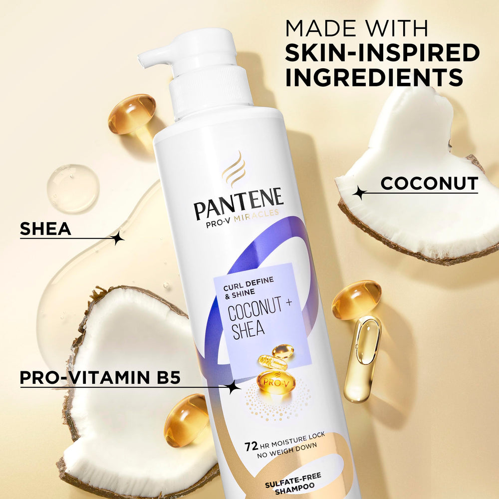Pantene Pro-V bottle next to hand showing 13.5 fl oz size