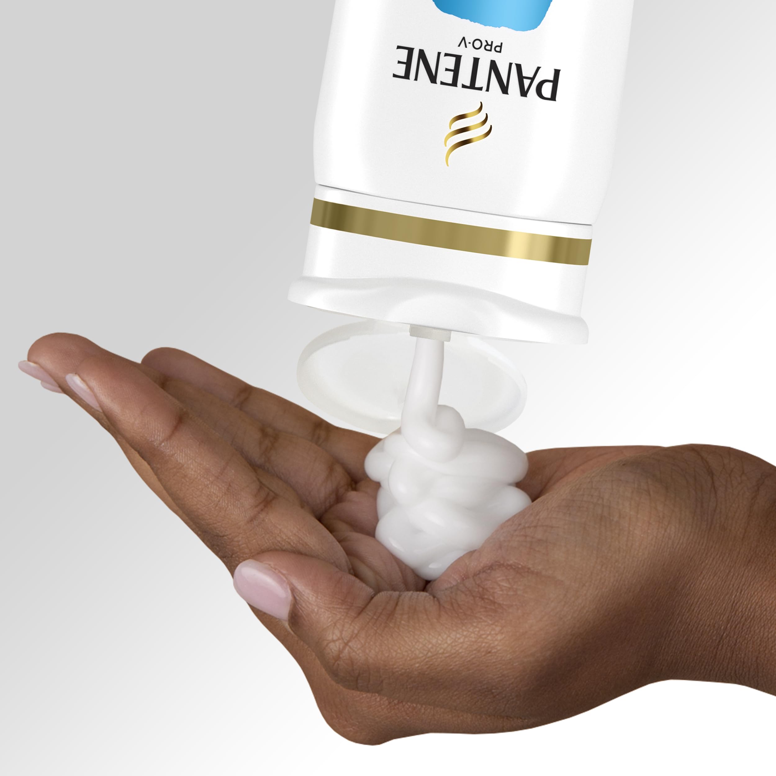 Person washing hair in shower using Pantene for fast 2-in-1 convenience
