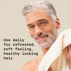 PAPATUI in‑shower use on man showing quick cleanse and conditioning benefit