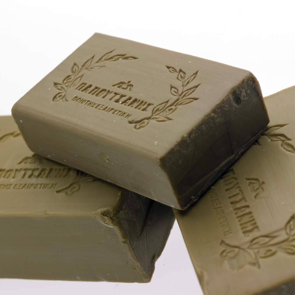 Papoutsanis soap placed near sink in bathroom, demonstrates practical travel-friendly use