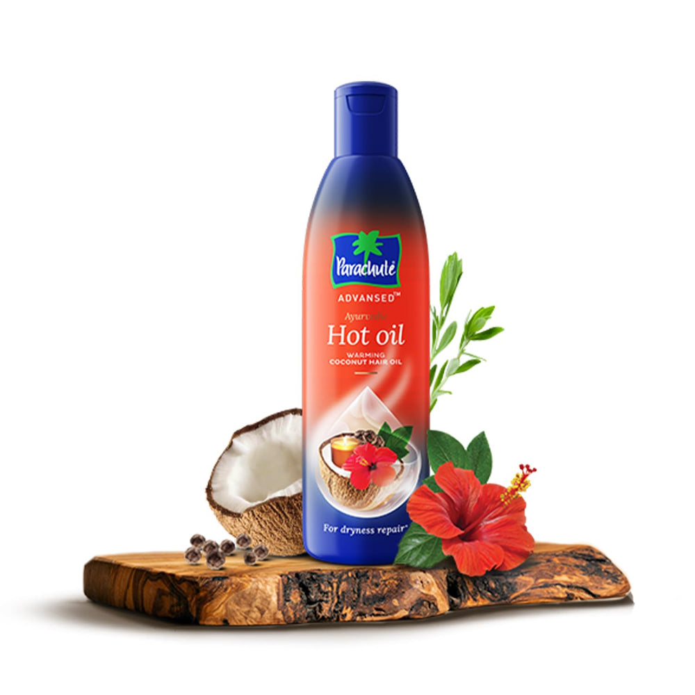 Parachute Advansed pouring oil from open cap for easy application