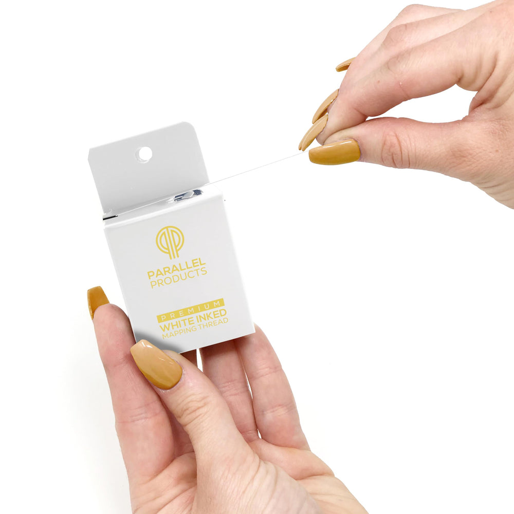PARALLEL PRODUCTS label and ink detail demonstrating high-contrast white