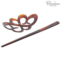 Parcelona in use bun styling with stick securing hair for all-day comfort