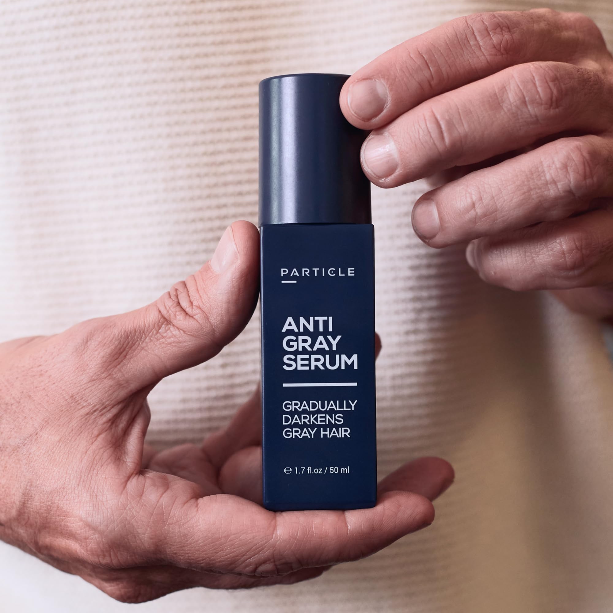 Particle serum applied to beard showing natural-looking gradual gray reduction advantage