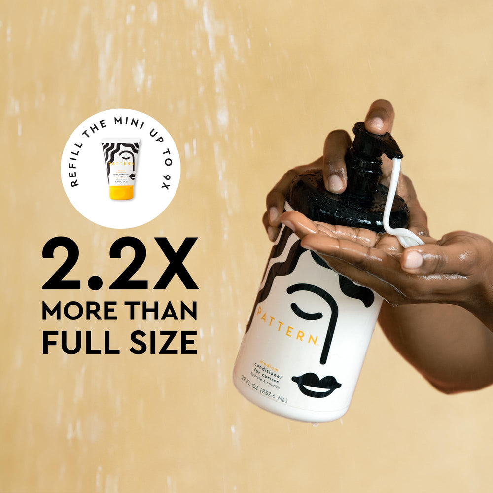 PATTERN 29 fl oz bottle beside a hand to show true size