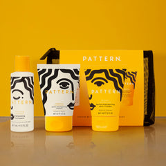 PATTERN kit staged in toiletry bag illustrating convenient travel-ready routine