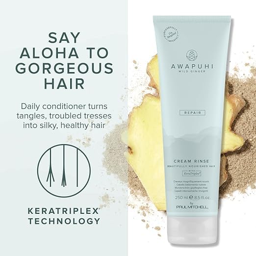 Hand holding Awapuhi Wild Ginger 2.5 fl oz bottle showing travel-friendly size