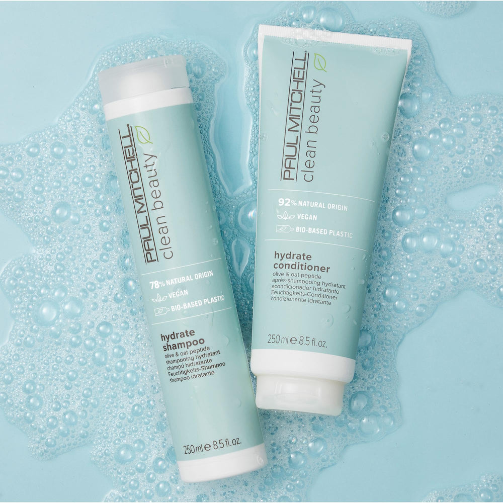 Paul Mitchell conditioner creamy texture on palm showing easy spread and hydration