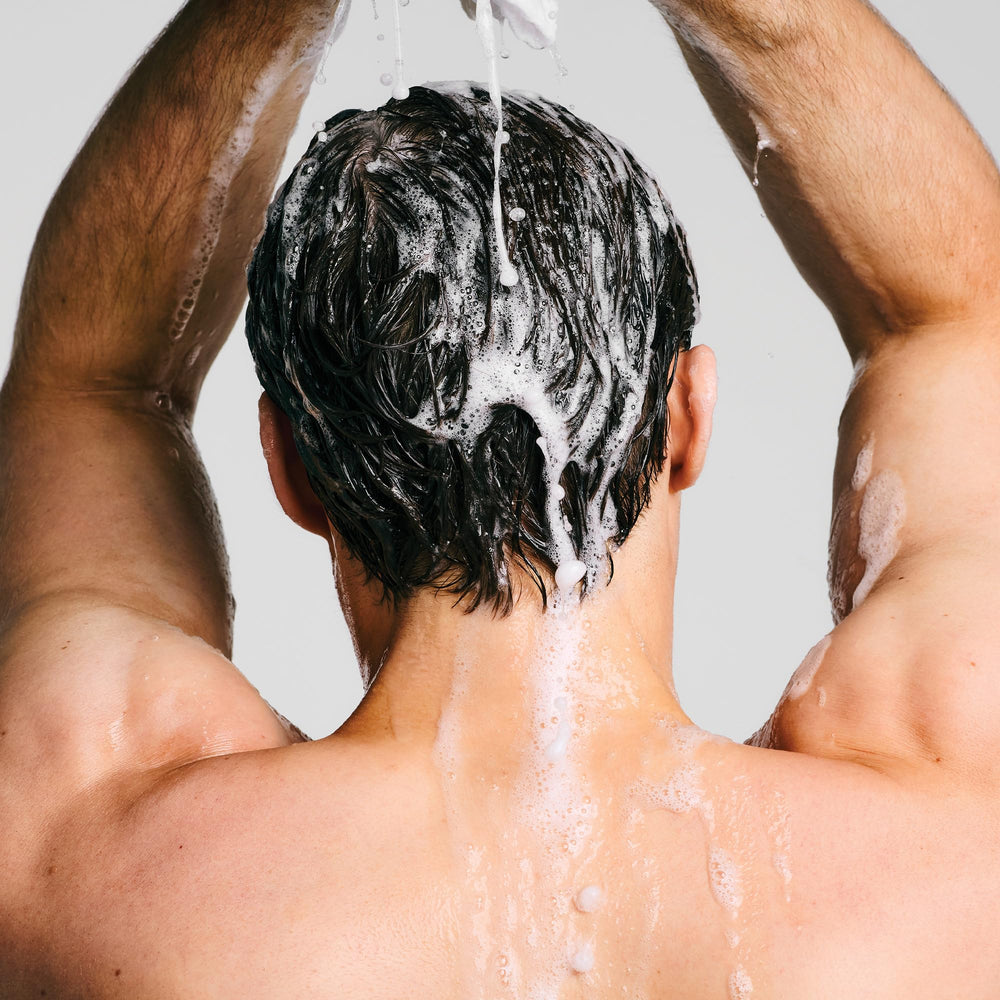 Paul Mitchell travel size held in hand for portability and on-the-go convenience