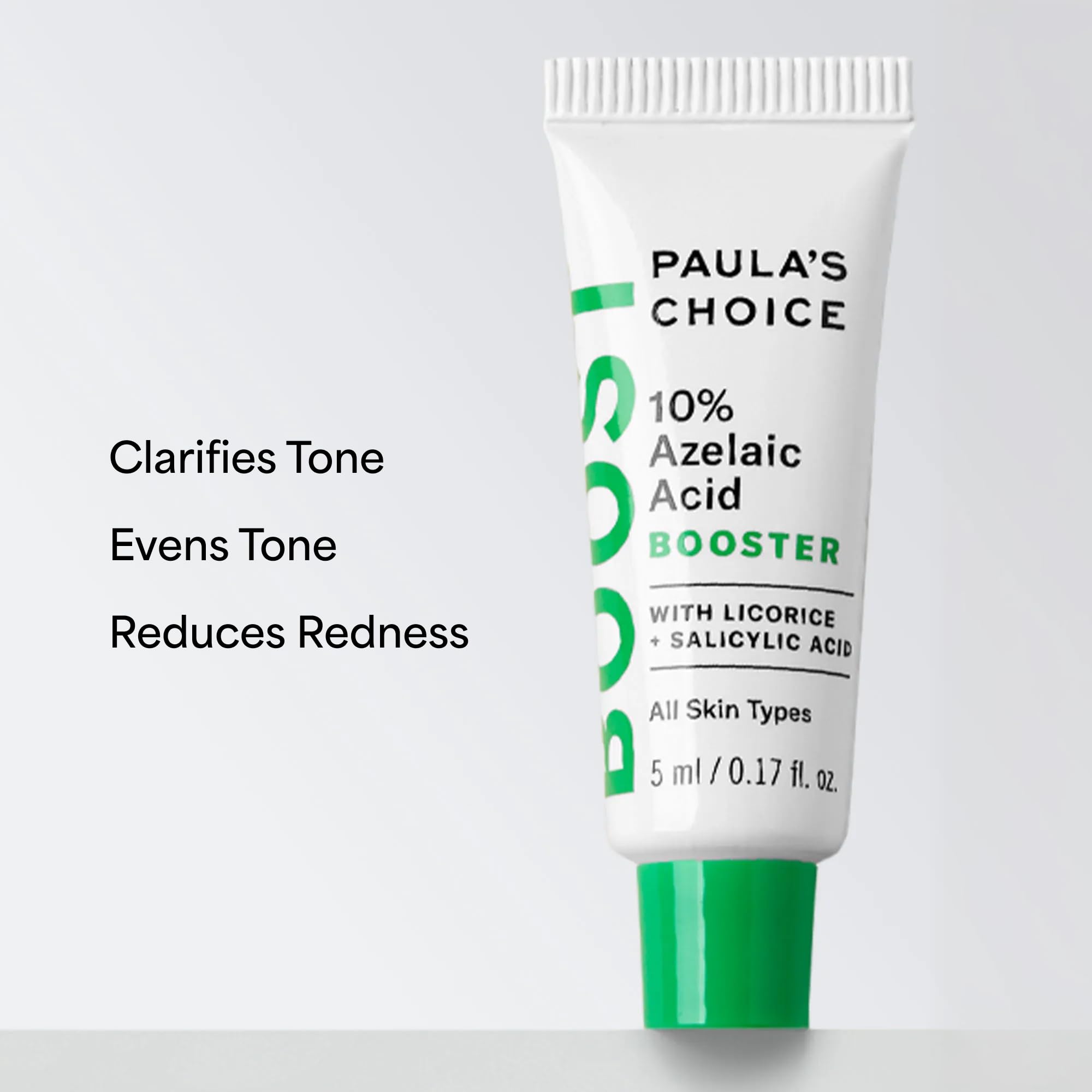 Paula's Choice bottle next to a ruler showing the compact travel size