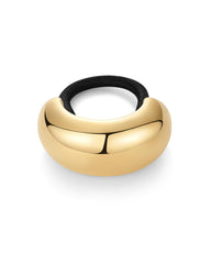 PAVOI cuff next to a coin showing scale and comfortable 22.4mm dome size