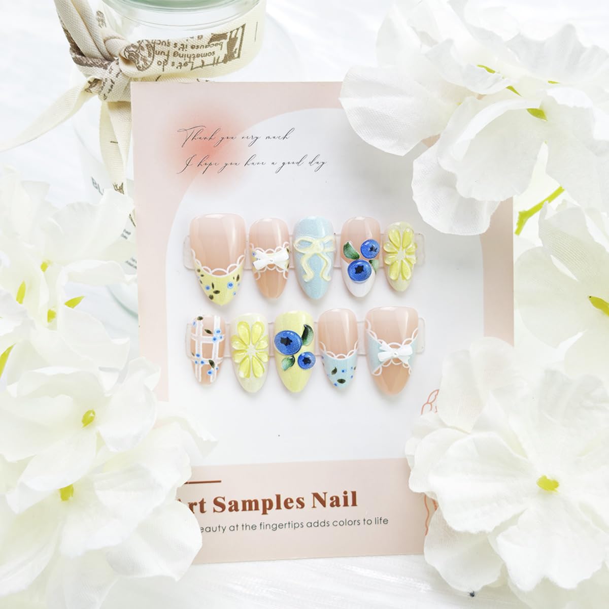 PBPCGBW nails held in hand to show short almond scale and practical everyday length