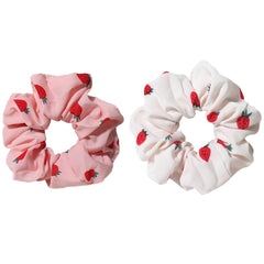 Pejlnd front view of strawberry print scrunchies showing colorful design and easy styling benefit