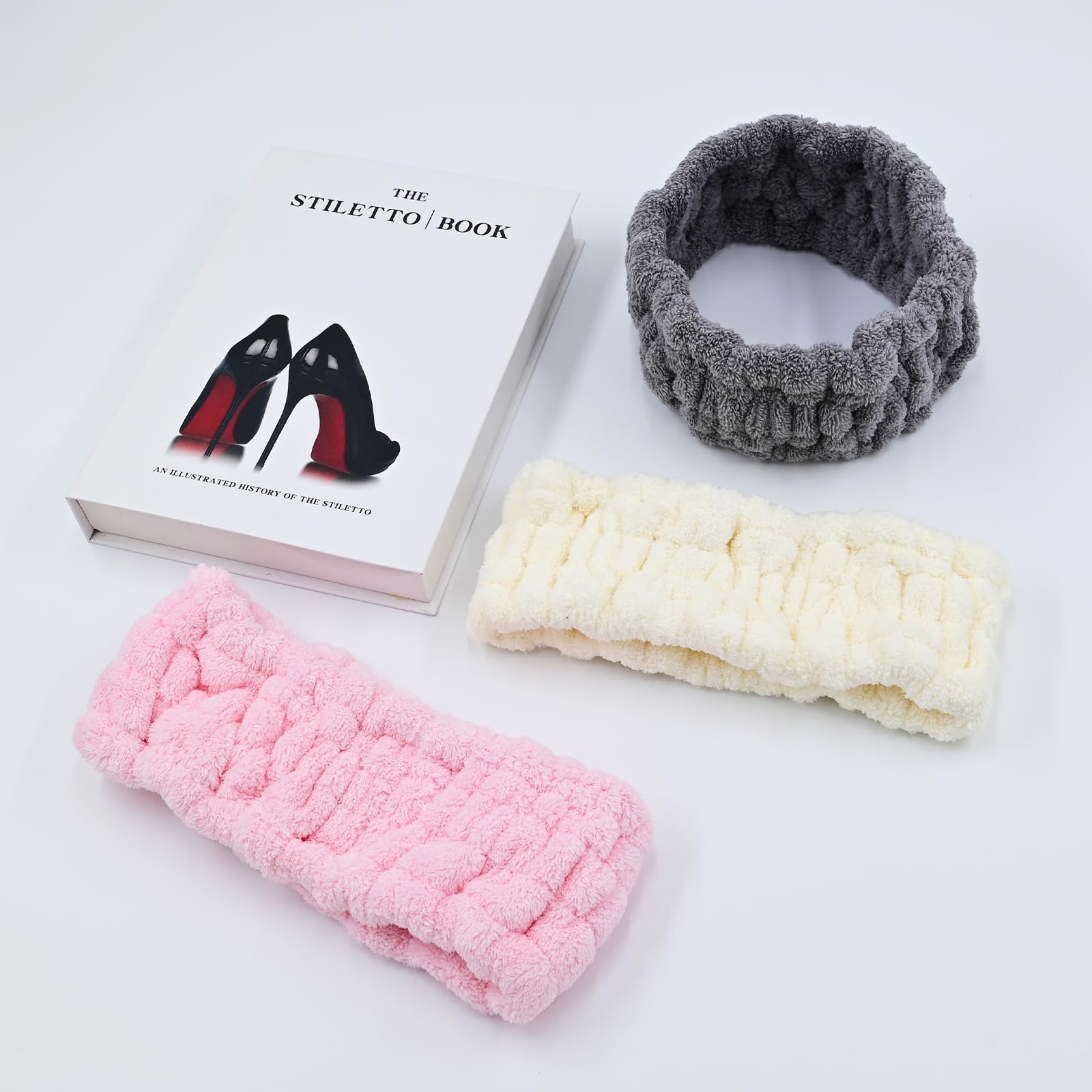 Pejnl flat lay of gray milk white and pink headbands, easy color options