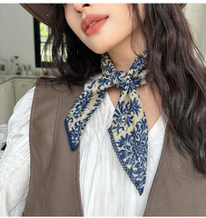 Pemilosci tied as a neck scarf showing polished accessory effect