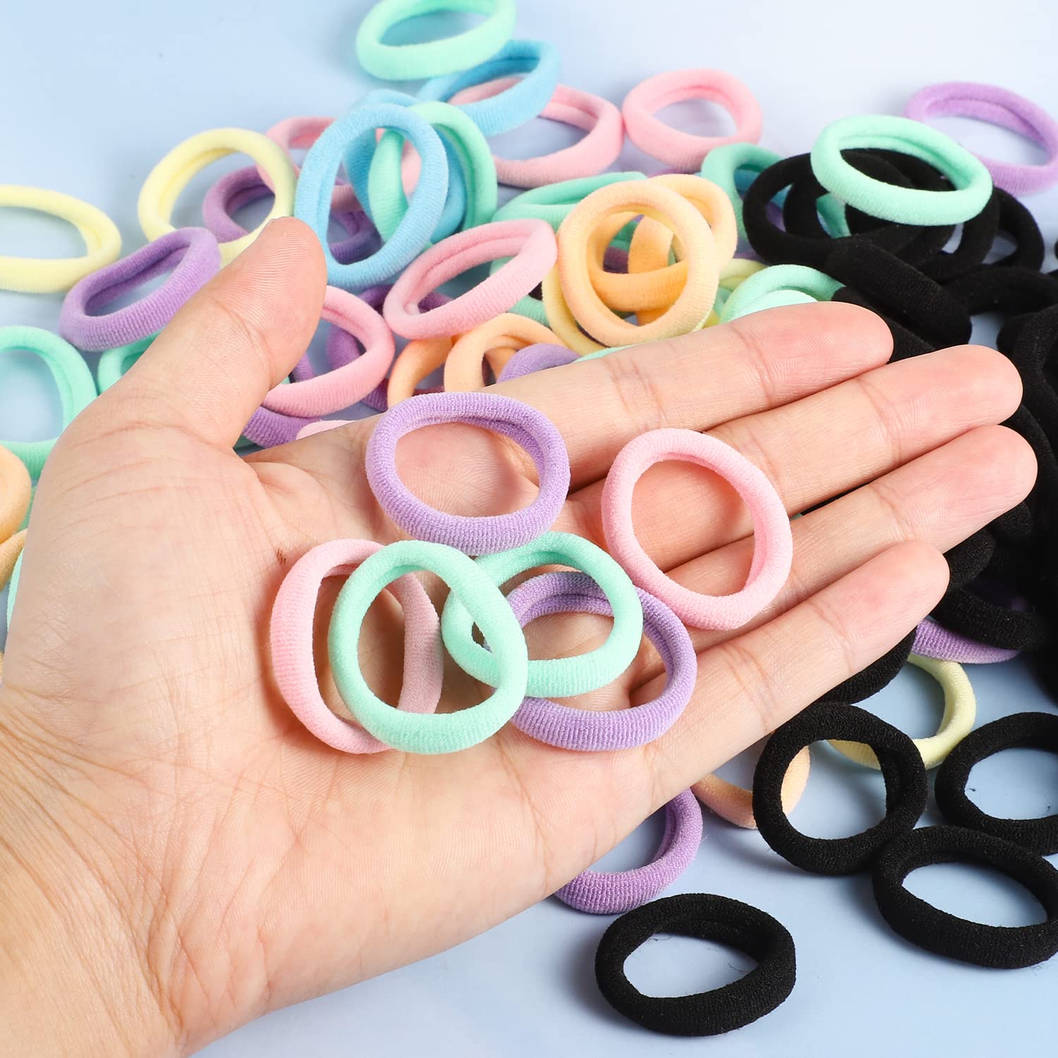 Pengxiaomei hair tie in a toddler ponytail demonstrating gentle secure hold during play