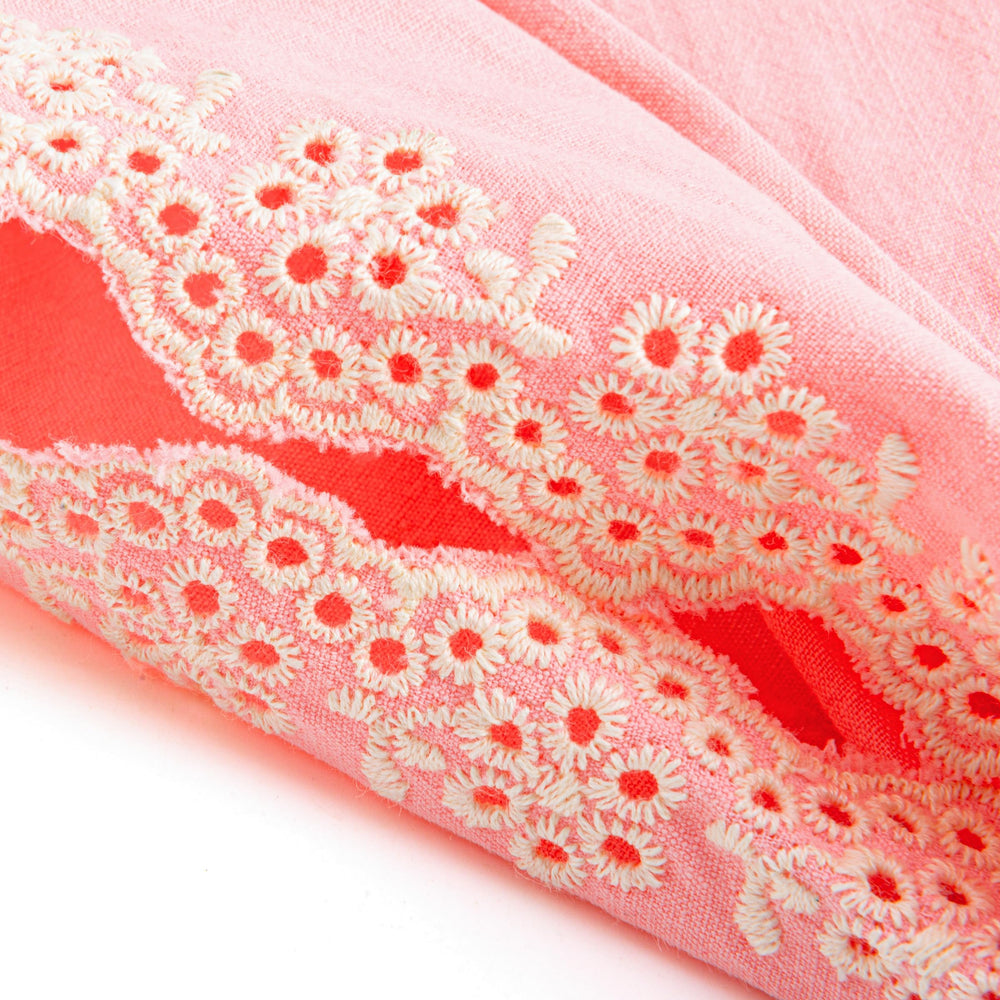 Peppercorn Kids close-up of embroidered eyelet flowers highlighting handcrafted detail