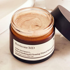 Perricone MD tube beside hand to show 2 fl oz scale and travel-friendly size