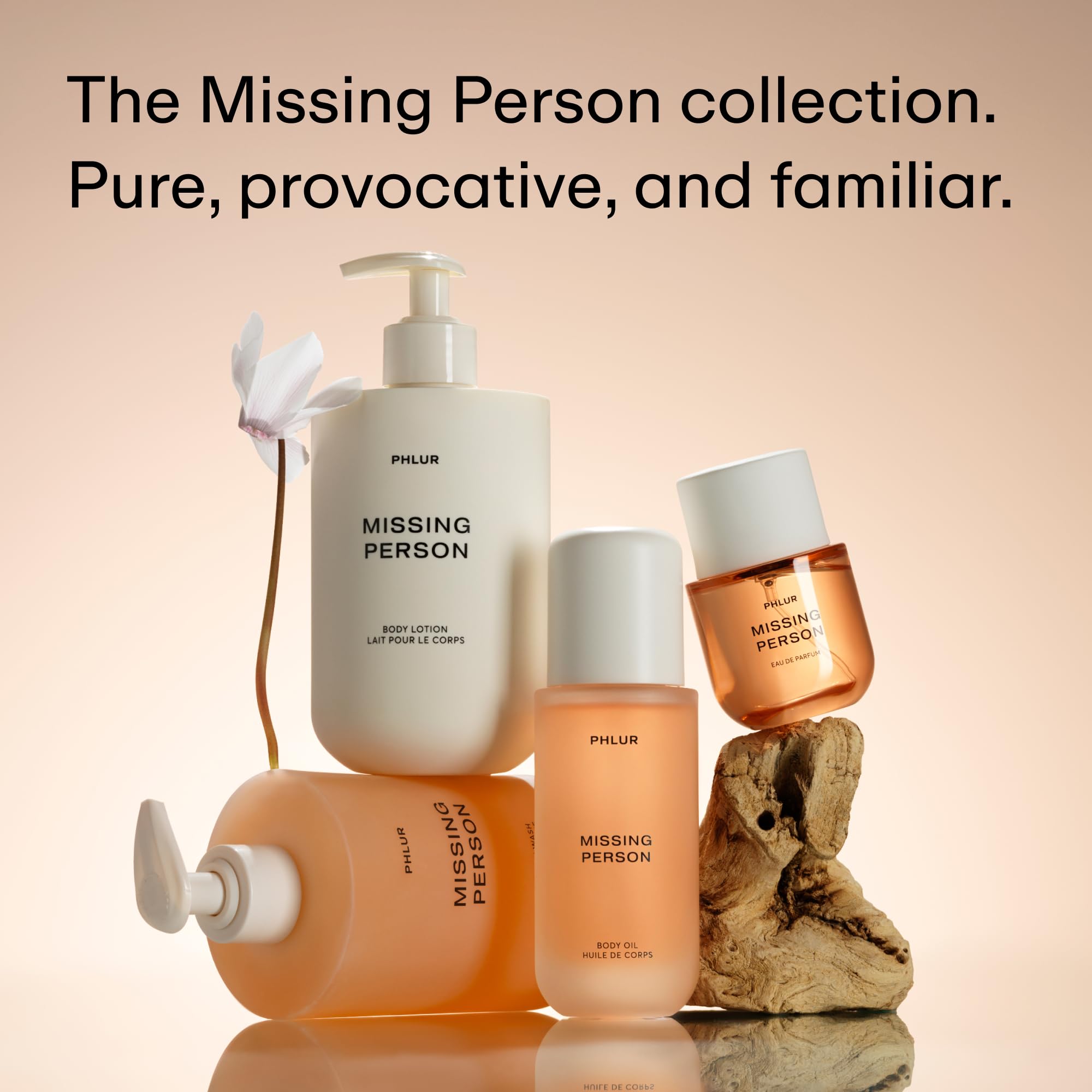 PHLUR on a bedside vanity with candle suggesting intimate, layered fragrance use