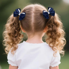 phnydreg girl wearing navy bow in ponytail demonstrating neat school-ready look