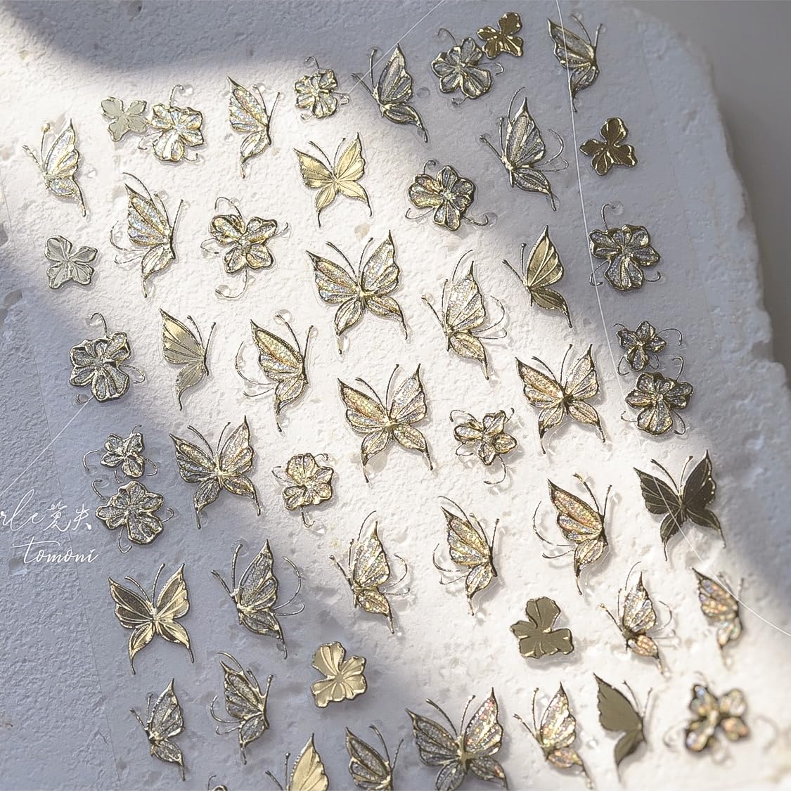 Phuryllic close-up of embossed butterfly texture, shows raised detail and sparkle