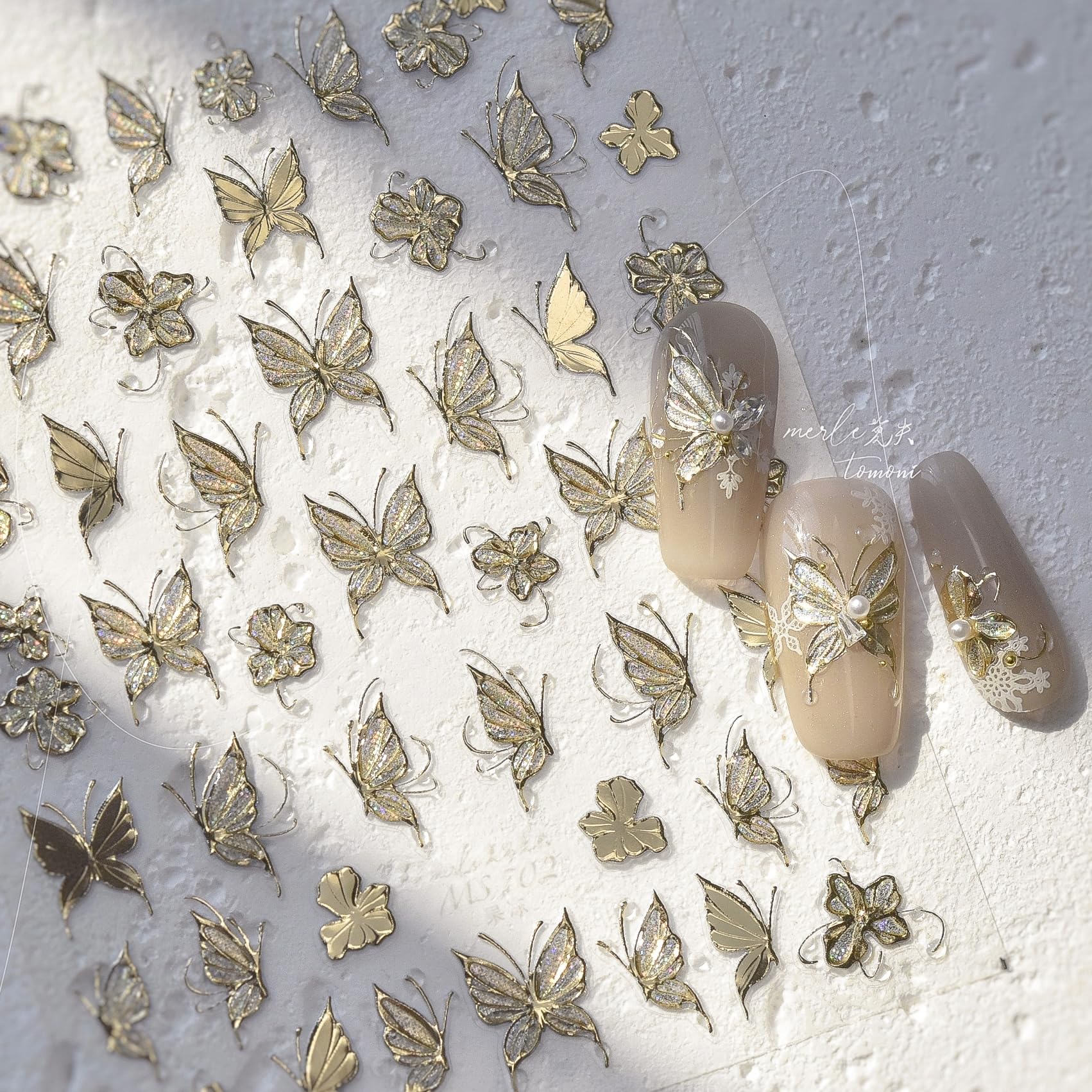 Phuryllic gold butterfly on finished manicure, adds elegant dimensional accent