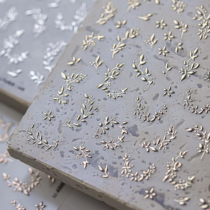Phuryllic macro of gold leaf detail delivering metallic shine and accenting nails