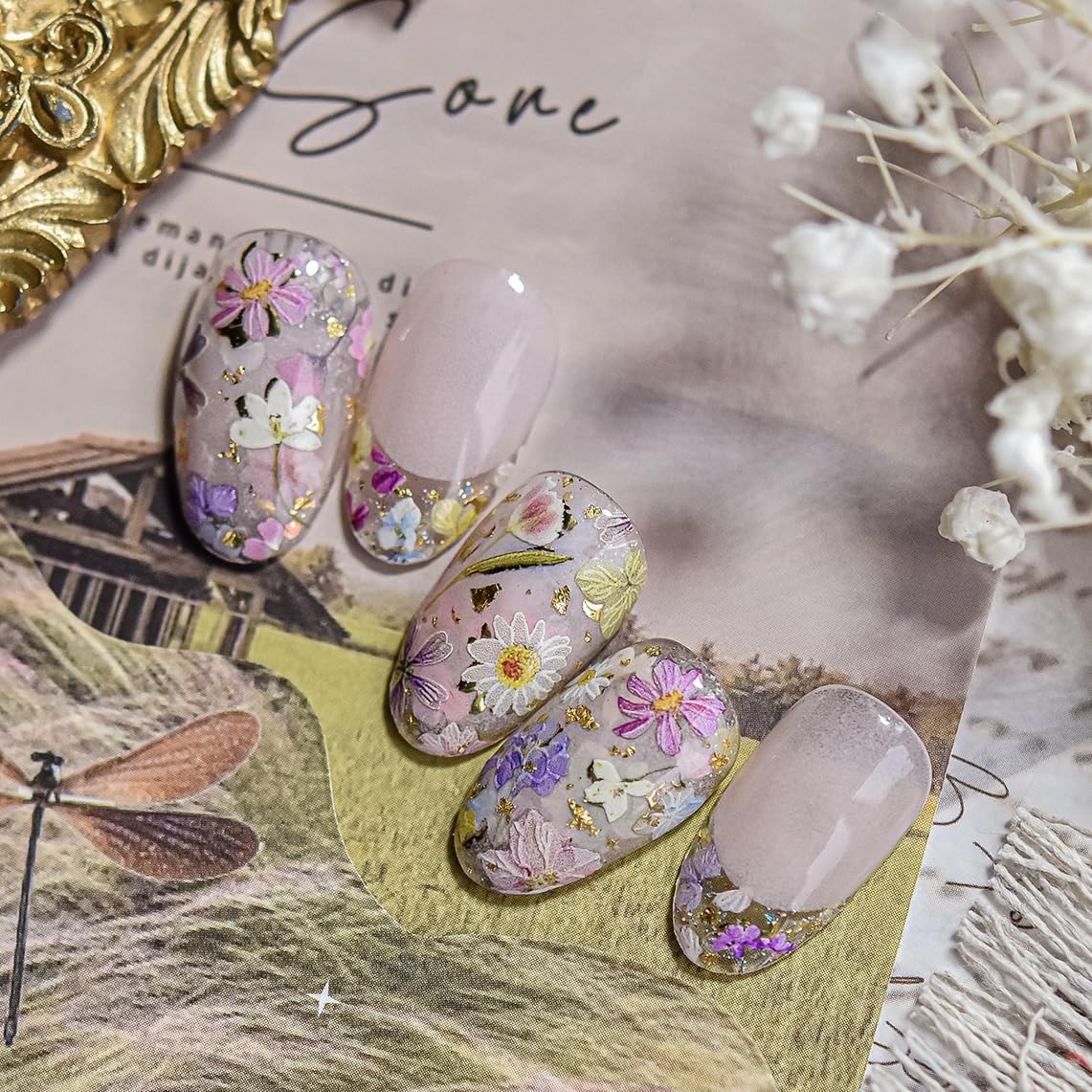 Holiday-themed floral nails created with Phuryllic stickers for seasonal looks