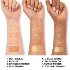 Physicians Formula bronzer held in hand to show compact size and travel convenience