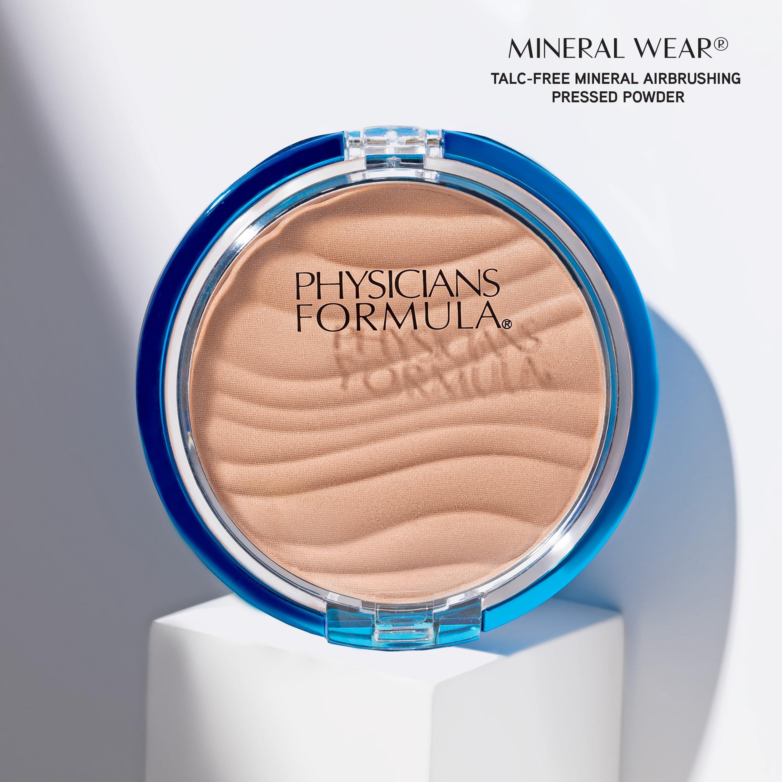Physicians Formula brush sweeping powder across skin for light setting and shine control benefit longwear