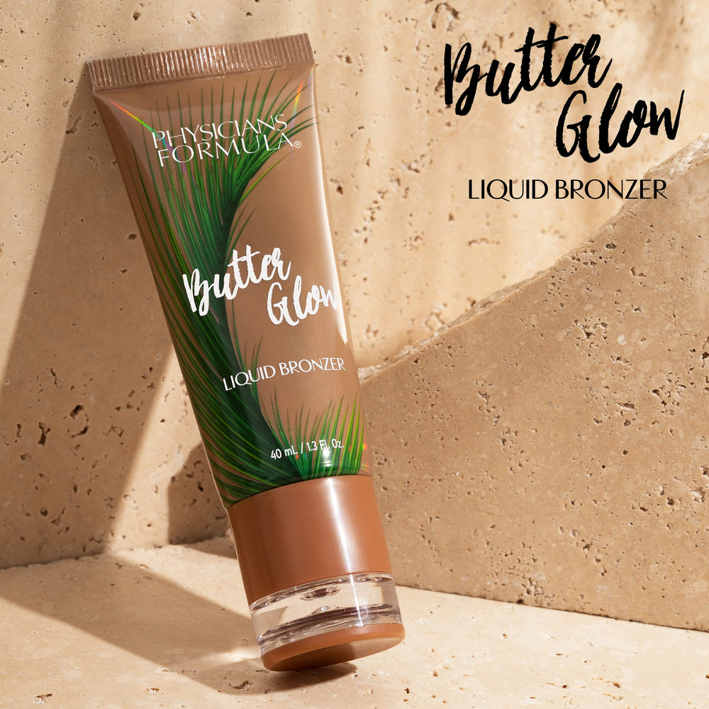 Physicians Formula liquid bronzer applied with fingers on cheek demonstrating smooth blendability and glow
