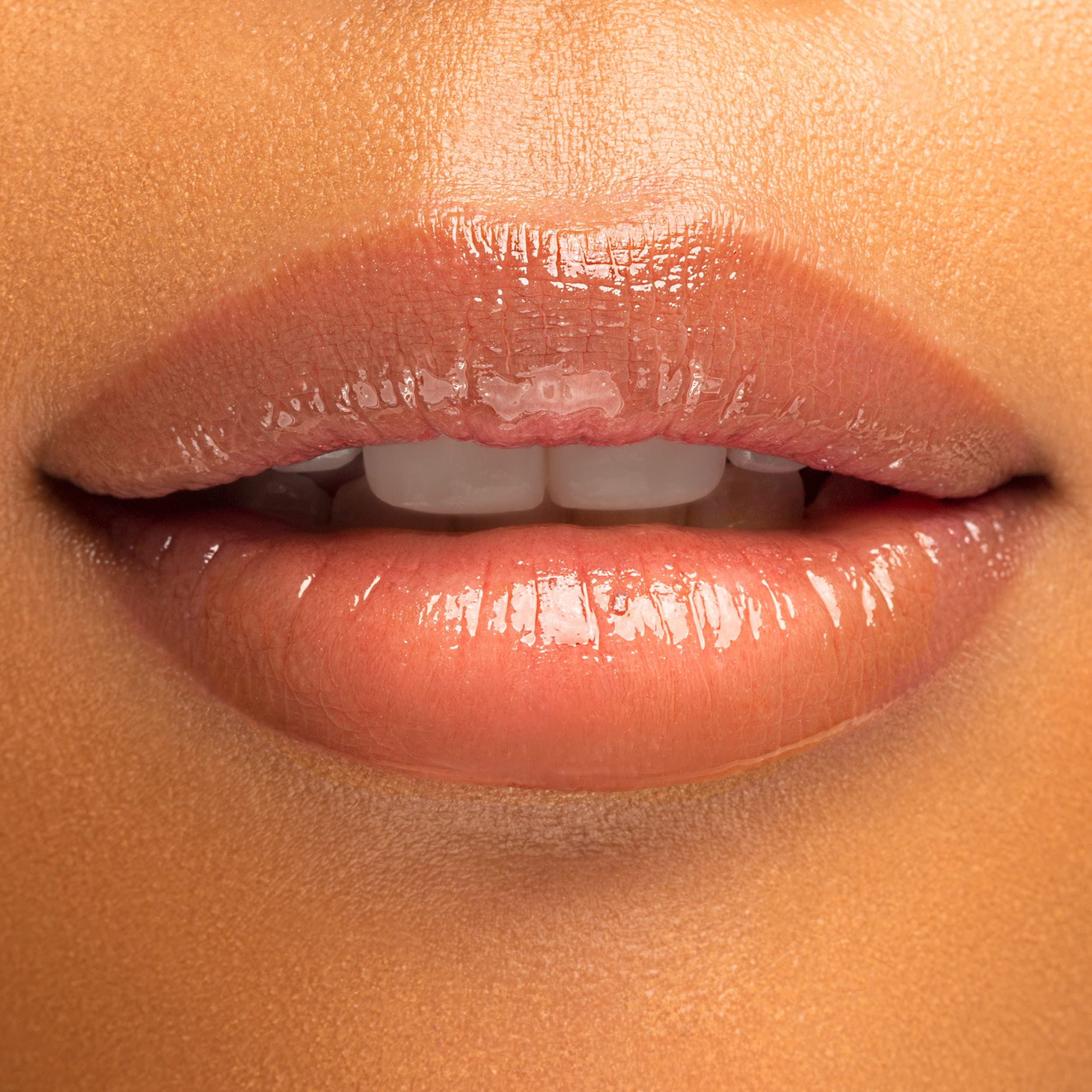 Physicians Formula texture swatch of serum-like gloss demonstrating lightweight shine
