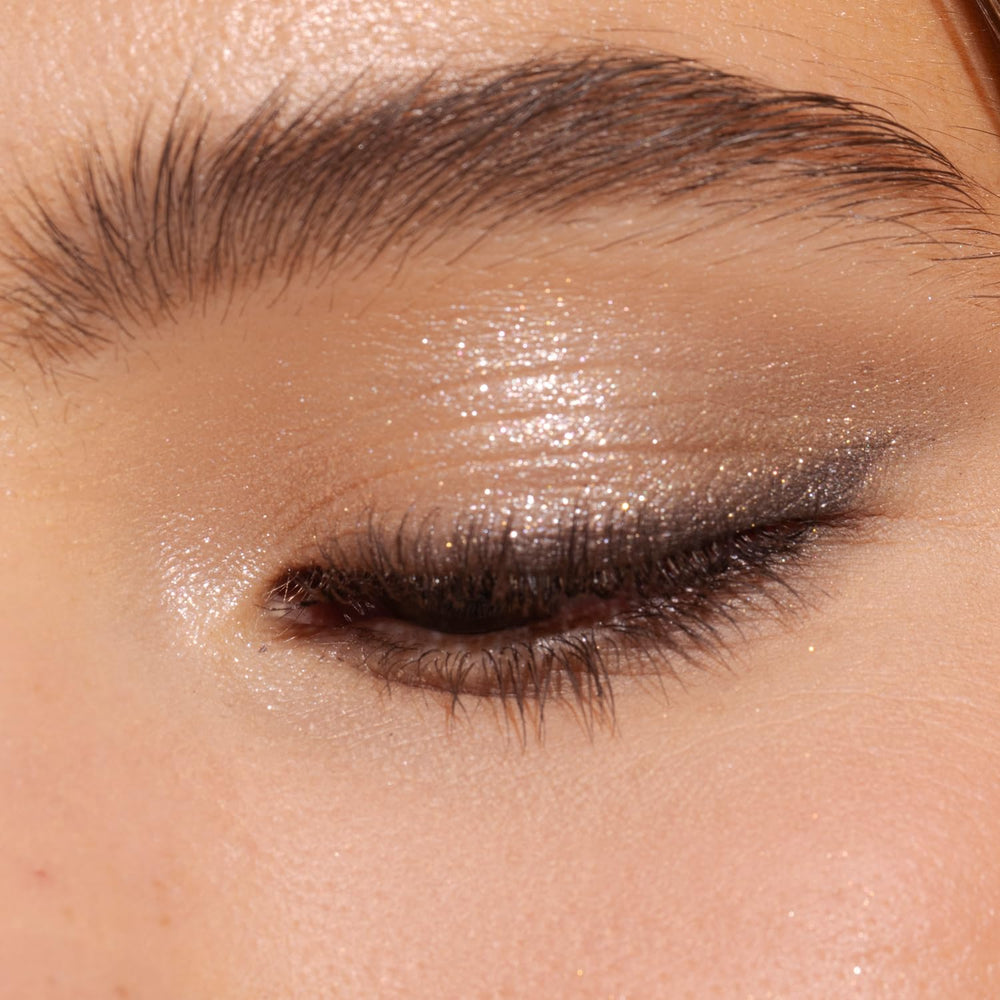 Physicians Formula swatch close-up demonstrating high-pigment nude shimmer for vivid payoff