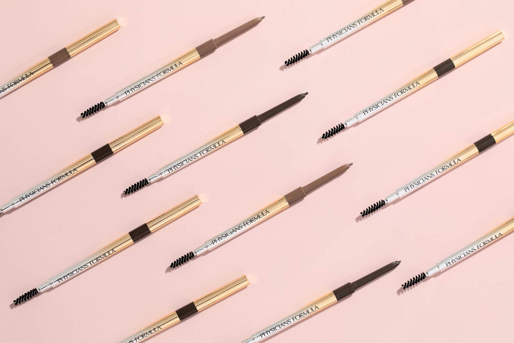 Physicians Formula pencil held in hand to show compact size and control