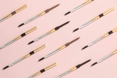 Physicians Formula pencil held in hand to show compact size and control