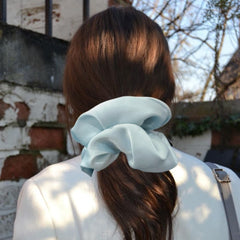 PIDOUDOU close-up satin texture highlighting smooth fabric that reduces hair friction