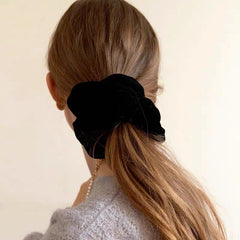 PIDOUDOU scrunchie worn in high ponytail demonstrating secure, comfortable hold