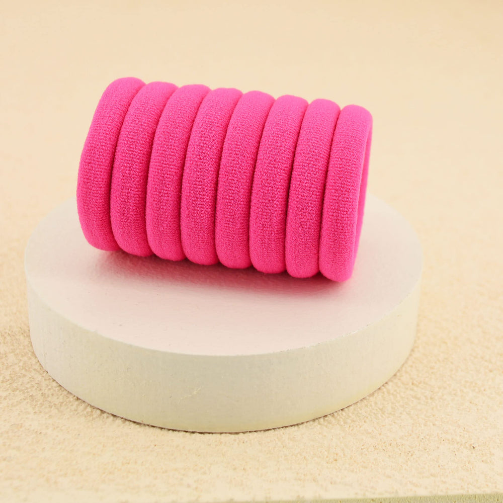 PIDOUDOU hair tie in high ponytail demonstrating secure hold during activity