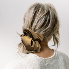 PIDOUDOU scrunchies in lifestyle scene next to outfit suggesting versatile everyday accessory
