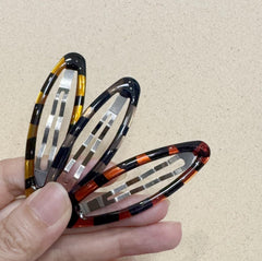 PIDOUDOU assorted tortoise and black clips spread out showing versatile styling options