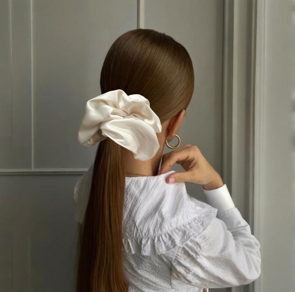 PIDOUDOU scrunchie securing a full bun for thick hair without tight creases