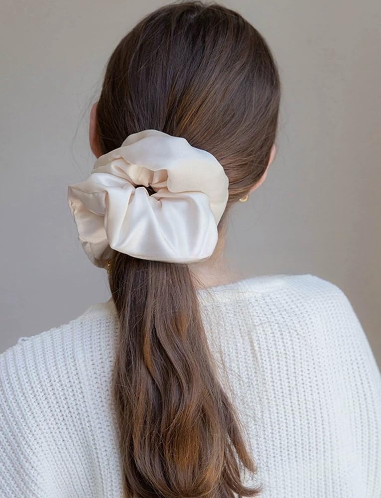 PIDOUDOU scrunchie worn on wrist as accessory demonstrating practical style