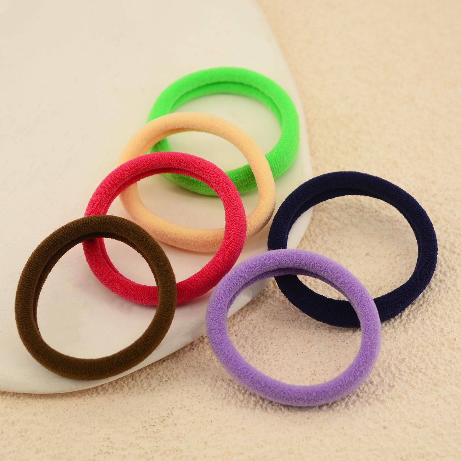 PIDOUDOU bundle in hand comparing size and stretch for everyday use