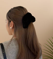 PIDOUDOU scrunchie in hand showing 5.5 inch size for thick hair visibility