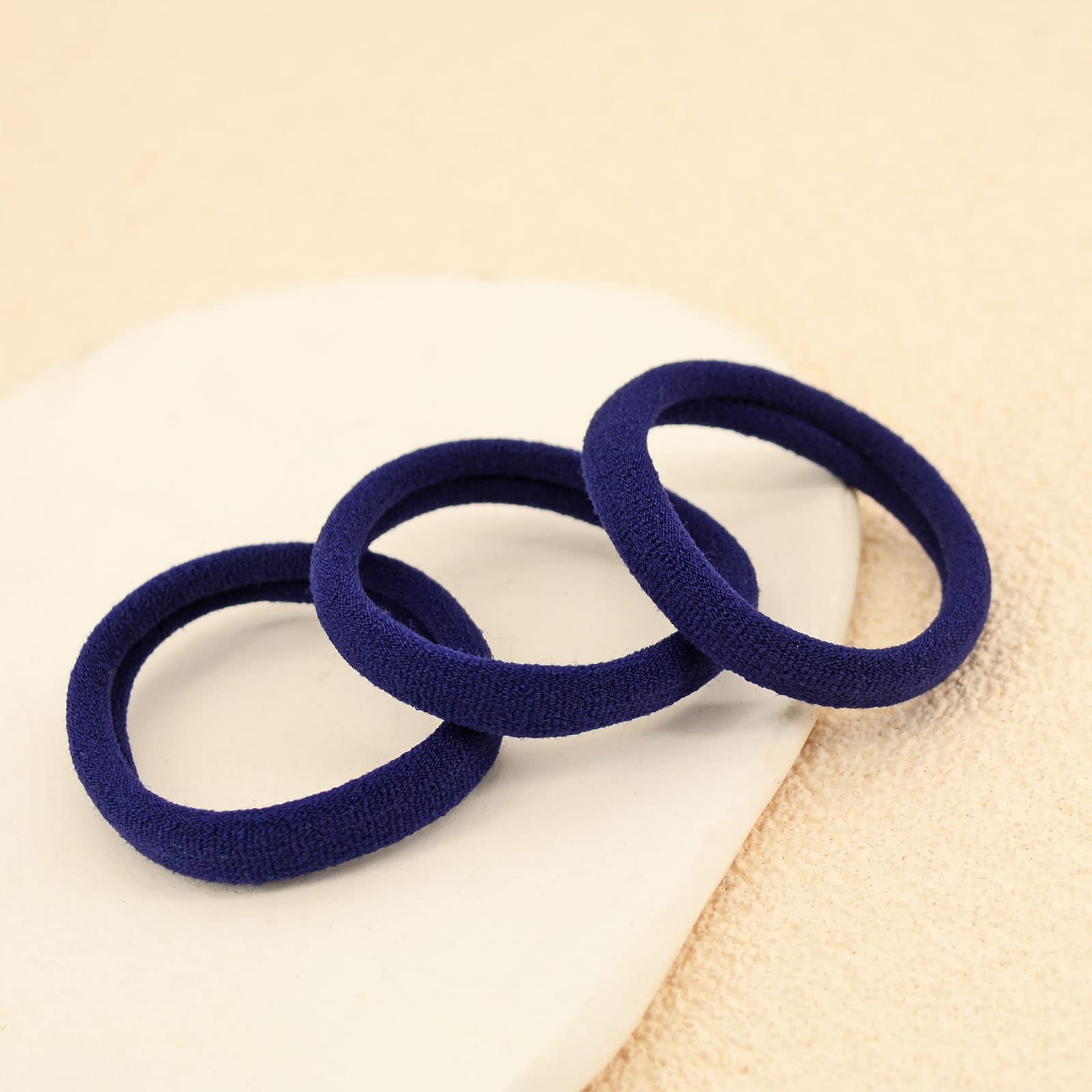 PIDOUDOU hair tie stretched to show elasticity and secure hold