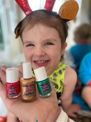 Child applying Piggy Paint safely with adult supervision, low odor benefit