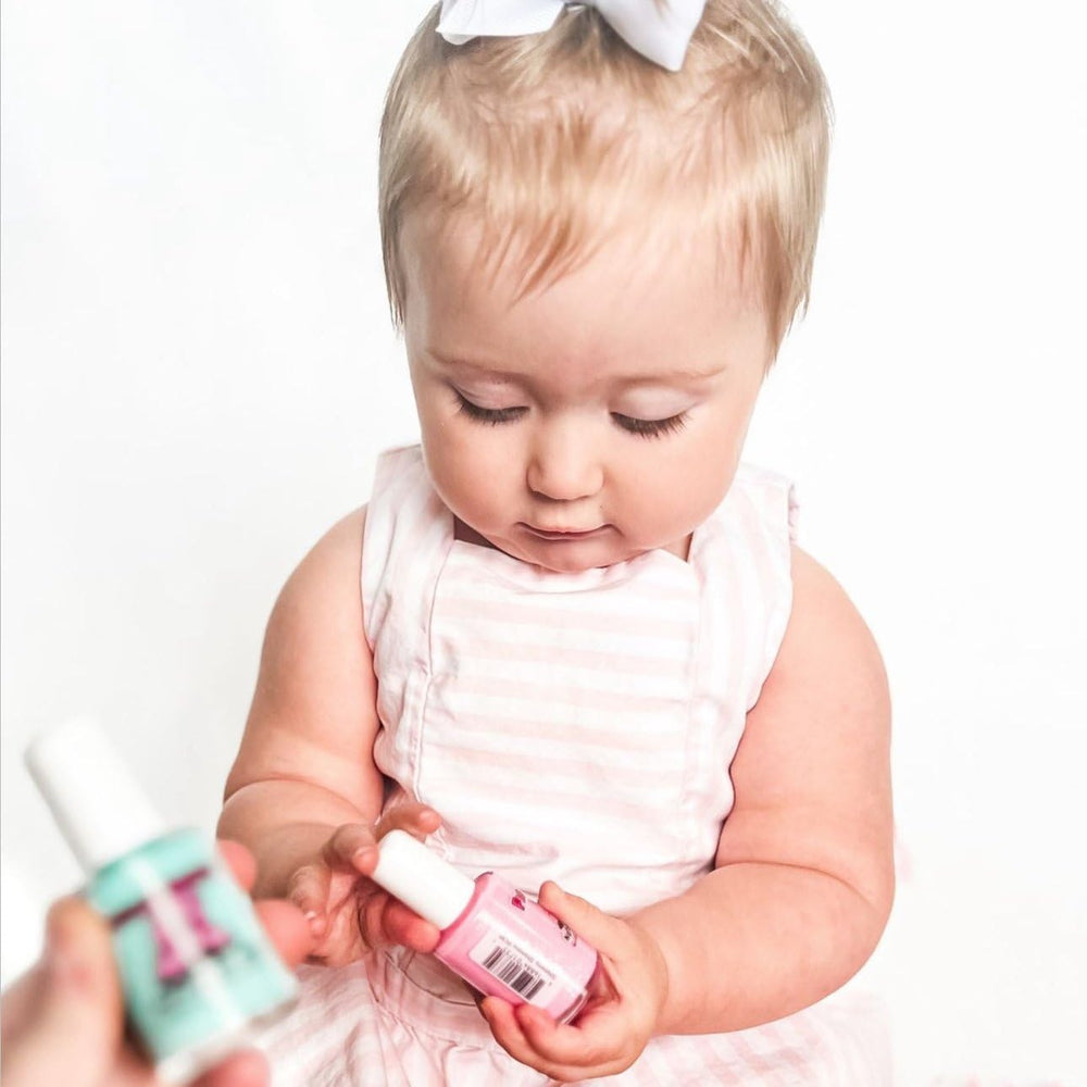 Family vanity scene with Piggy Paint polishes showing safe, shared beauty moments