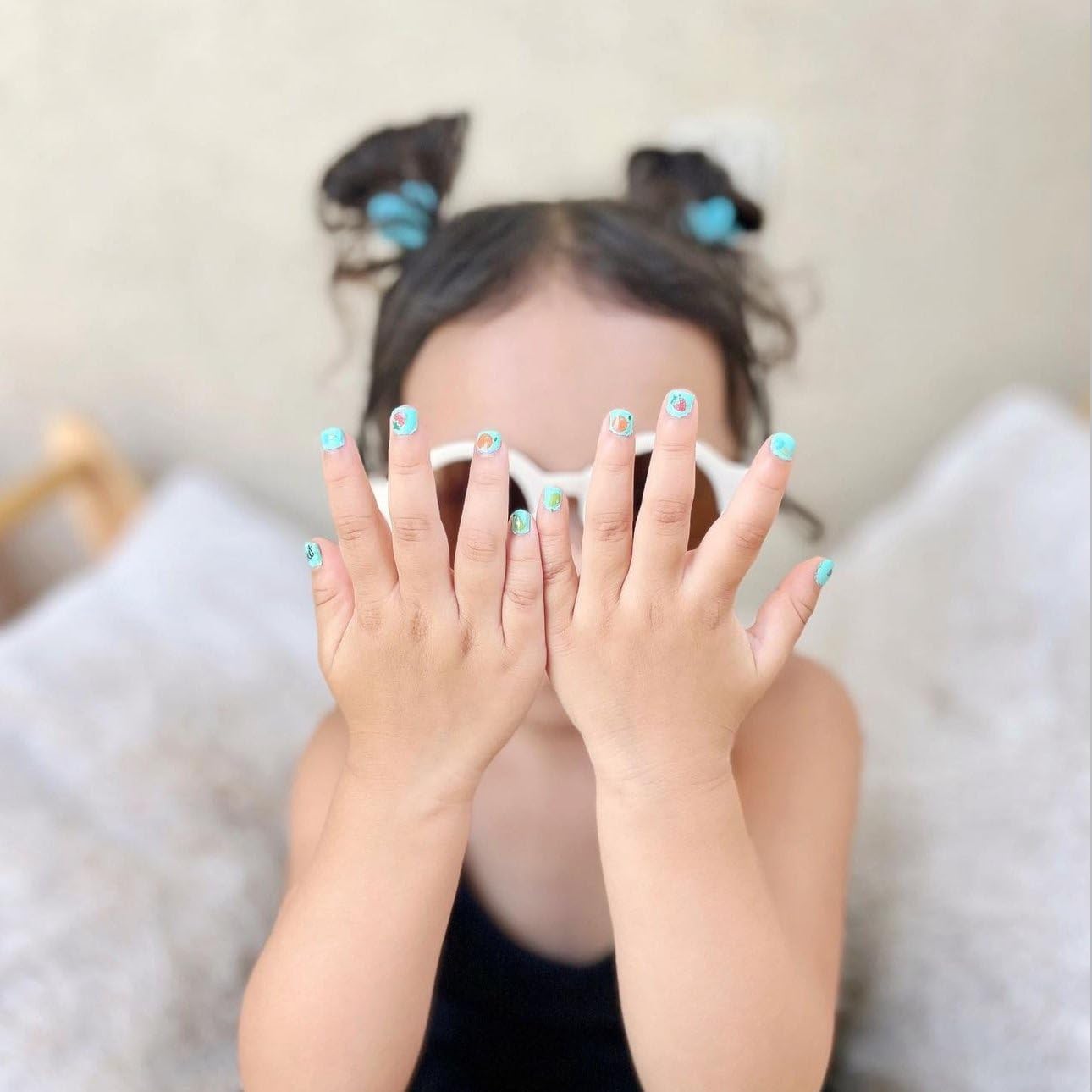 Packaging and ingredient list for Piggy Paint highlighting non-toxic claims