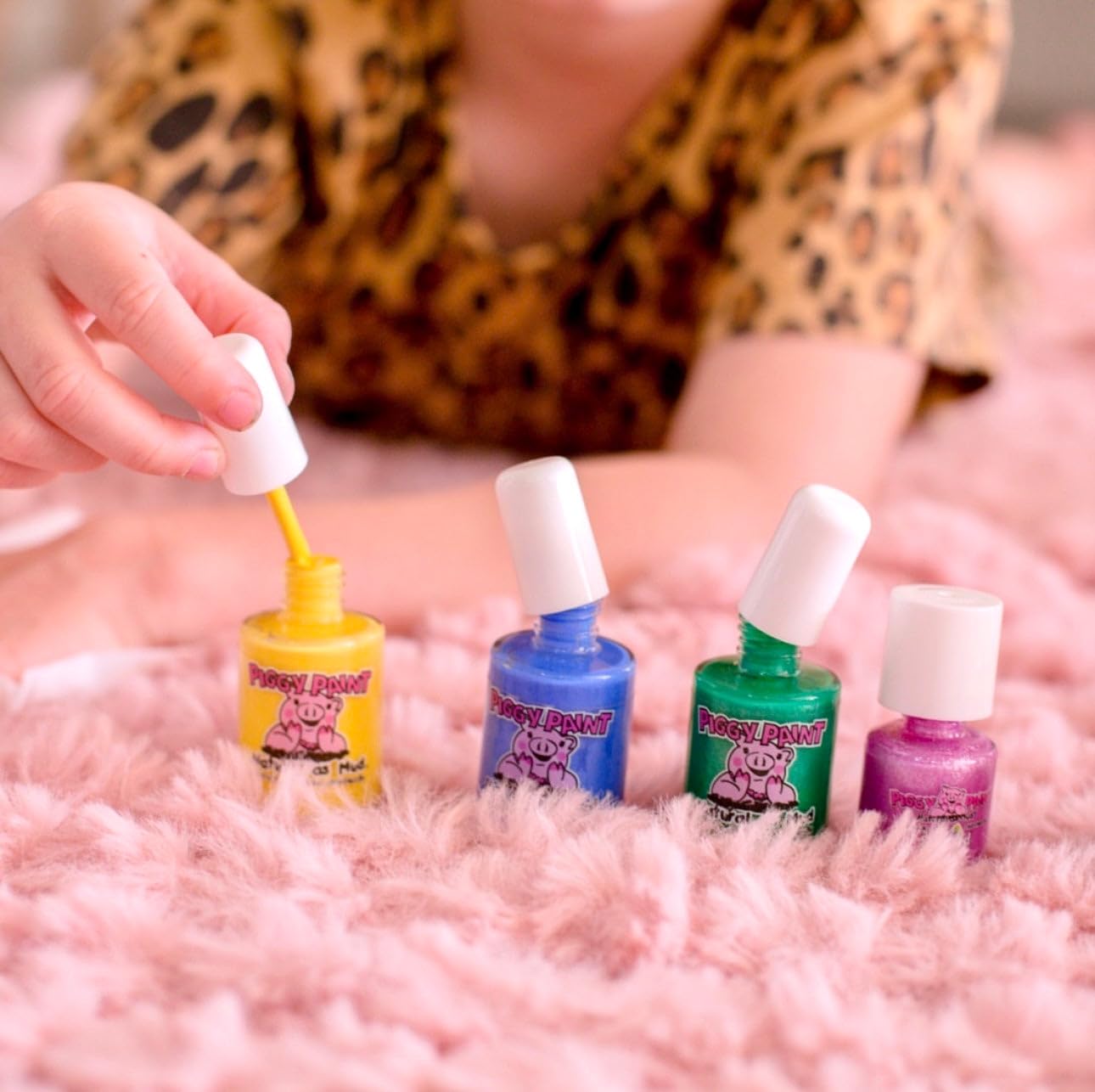 Children at party wearing Piggy Paint shimmer green illustrating safe playful styling